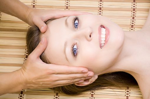 Masseuse Does Relax Facial Massage To The Girl