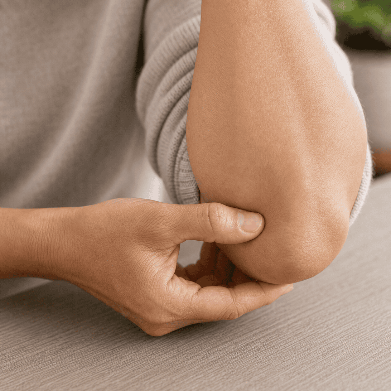 Self-care acupressure around the back of the elbow in the soft hollow above the elbow tip